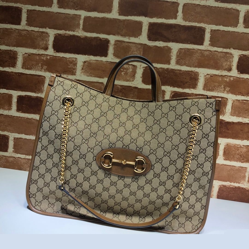 G*u*i shopping bags